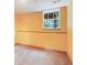 Unfinished basement featuring paneled walls with baseboard, carpeted floors, and natural light at 259 Pine Valley Dr, Powder Springs, GA 30127