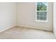 Bedroom featuring carpeted floors and a large window at 259 Pine Valley Dr, Powder Springs, GA 30127