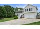Well-maintained two-story home featuring a charming front porch and an attached two-car garage at 259 Pine Valley Dr, Powder Springs, GA 30127