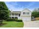 Charming two-story home with a welcoming front porch, tidy landscaping, and a two-car garage at 259 Pine Valley Dr, Powder Springs, GA 30127