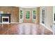 Tile-floored dining area with stainless steel appliances and a view of fireplace at 259 Pine Valley Dr, Powder Springs, GA 30127