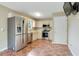 Spacious kitchen with stainless steel appliances, ample cabinet space, and tile flooring at 259 Pine Valley Dr, Powder Springs, GA 30127