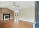Bright living room featuring hardwood floors, a fireplace, and ample natural light at 259 Pine Valley Dr, Powder Springs, GA 30127