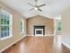 Cozy living room showcasing hardwood floors, a fireplace, and a vaulted ceiling at 259 Pine Valley Dr, Powder Springs, GA 30127