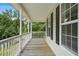 Inviting covered porch with white railings, offering a relaxing outdoor space at 259 Pine Valley Dr, Powder Springs, GA 30127