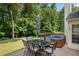 Backyard featuring a table, chairs, grill, and hot tub at 4321 Sugar Maple Chase Nw, Acworth, GA 30101
