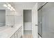Bright bathroom with dual sinks, shower, and separate water closet at 4321 Sugar Maple Chase Nw, Acworth, GA 30101