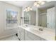 Bright bathroom featuring dual sinks, and a glass-enclosed shower at 4321 Sugar Maple Chase Nw, Acworth, GA 30101