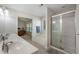 Bright bathroom with soaking tub and glass-enclosed shower at 4321 Sugar Maple Chase Nw, Acworth, GA 30101