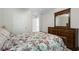 Comfortable bedroom with a floral comforter and hardwood furniture at 4321 Sugar Maple Chase Nw, Acworth, GA 30101