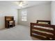 Bedroom with plush carpeting, a window and a bed and desk furniture set at 4321 Sugar Maple Chase Nw, Acworth, GA 30101