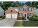 Charming two-story brick home with a well-manicured lawn and a two-car garage at 4321 Sugar Maple Chase Nw, Acworth, GA 30101