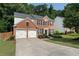 Inviting two-story home with red brick and black shutters, complemented by a green lawn at 4321 Sugar Maple Chase Nw, Acworth, GA 30101