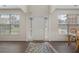 Bright foyer with a white door, sidelights, hardwood floors, and natural light at 4321 Sugar Maple Chase Nw, Acworth, GA 30101