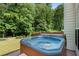 Outdoor hot tub on a stone patio at 4321 Sugar Maple Chase Nw, Acworth, GA 30101