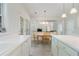 Bright kitchen with white cabinets, tile floors, eat in area and view to the living room at 4321 Sugar Maple Chase Nw, Acworth, GA 30101