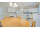Eat-in kitchen featuring white cabinets, an island, stainless steel appliances, and plenty of counter space at 4321 Sugar Maple Chase Nw, Acworth, GA 30101