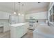 Bright kitchen with stainless steel appliances, an island, and lots of white cabinets and counter space at 4321 Sugar Maple Chase Nw, Acworth, GA 30101