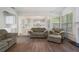 Spacious living room with hardwood floors, a fireplace, and an open view to the kitchen at 4321 Sugar Maple Chase Nw, Acworth, GA 30101