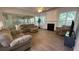 Open-concept living room features wood floors, a fireplace, and ample natural light at 4321 Sugar Maple Chase Nw, Acworth, GA 30101