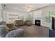 Comfortable living room with a fireplace, vaulted ceilings, and lots of natural light at 4321 Sugar Maple Chase Nw, Acworth, GA 30101