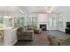 Open concept living room with a fireplace, large windows, and hardwood floors throughout at 4321 Sugar Maple Chase Nw, Acworth, GA 30101