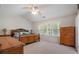 Bright main bedroom featuring a ceiling fan and natural light from large windows at 4321 Sugar Maple Chase Nw, Acworth, GA 30101