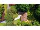 Overhead shot reveals the home's layout, nestled among mature trees and a well-manicured lawn at 4717 Westhampton Dr, Tucker, GA 30084