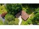 An aerial view showcases the property's roof, driveway, and lush surrounding landscape at 4717 Westhampton Dr, Tucker, GA 30084