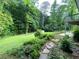 View of the backyard featuring a lush grassy lawn at 4717 Westhampton Dr, Tucker, GA 30084