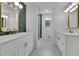 Bright bathroom featuring dual vanities, gold fixtures, and recessed lighting at 4717 Westhampton Dr, Tucker, GA 30084