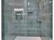 Bathroom with shower featuring teal tile and gold shower head at 4717 Westhampton Dr, Tucker, GA 30084