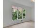 Bedroom featuring ample natural light, clean white walls, and three-panel windows at 4717 Westhampton Dr, Tucker, GA 30084