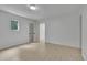 Bright bedroom with light-colored floors, white walls, and open doorway at 4717 Westhampton Dr, Tucker, GA 30084