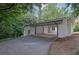 Attached carport with a painted brick exterior, offering ample parking and convenient access to the home at 4717 Westhampton Dr, Tucker, GA 30084