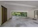 Spacious carport offering covered parking with an entryway door and natural light at 4717 Westhampton Dr, Tucker, GA 30084