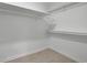 Walk-in closet with shelves and wood floor at 4717 Westhampton Dr, Tucker, GA 30084