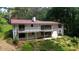 Exterior rear view of house with back deck and white brick at 4717 Westhampton Dr, Tucker, GA 30084