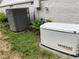 Exterior view of AC and generator unit ensuring comfort and reliability for the home at 4717 Westhampton Dr, Tucker, GA 30084