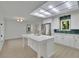 Open-concept kitchen featuring a large island, stainless steel appliances, and teal tile backsplash at 4717 Westhampton Dr, Tucker, GA 30084