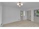 Spacious living room with wood floors and updated lighting at 4717 Westhampton Dr, Tucker, GA 30084