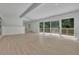 Bright living room features an open layout and sliding doors to a deck overlooking a wooded area at 4717 Westhampton Dr, Tucker, GA 30084