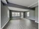 Bright and airy living room featuring hardwood floors, large windows, and neutral wall color at 629 Windsor Sw St, Atlanta, GA 30312
