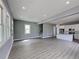 Open-concept living space with hardwood floors, seamlessly connecting the living room and kitchen at 629 Windsor Sw St, Atlanta, GA 30312