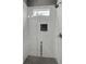 Modern shower featuring sleek tile, a glass enclosure, and natural light from a window at 629 Windsor Sw St, Atlanta, GA 30312