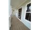 Covered balcony with modern railings and a view of the neighborhood at 115 Pinecone Pkwy, Alpharetta, GA 30022