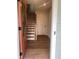 Inviting entryway featuring hardwood floors, wood stairs, and a stylish front door at 115 Pinecone Pkwy, Alpharetta, GA 30022