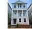 Charming, two-story home featuring a welcoming front porch and light blue siding at 115 Pinecone Pkwy, Alpharetta, GA 30022