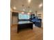 Modern kitchen with an island, stainless steel appliances, and stylish dark blue cabinetry at 115 Pinecone Pkwy, Alpharetta, GA 30022
