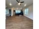 Spacious, light-filled open floorplan seamlessly connecting the living room and kitchen areas at 115 Pinecone Pkwy, Alpharetta, GA 30022